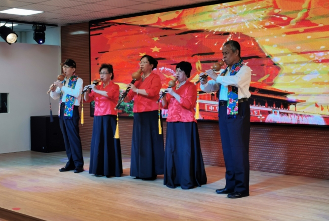Performers play a cucurbit flute song at a White Cane Safety Day event in Beijing, on October 11, 2019. [Photo: China Plus/Li Yi]