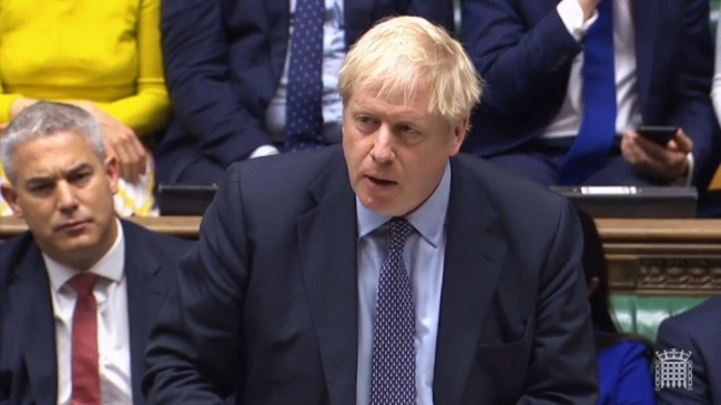 A grab from a handout video made available by the UK Parliamentary Recording Unit shows British Prime Minister Boris Johnson delivering a speech to MPs at the House of Commons in London, Britain, October 19, 2019. [Photo: IC/EPA]