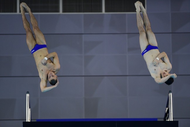 German divers Lou Noel Guy Massenberg (R) and Timo Barthel in the men's synchronized platform final at the 7th Military World Games in Wuhan, China on Oct 25, 2019. [Photo provided to China Plus]