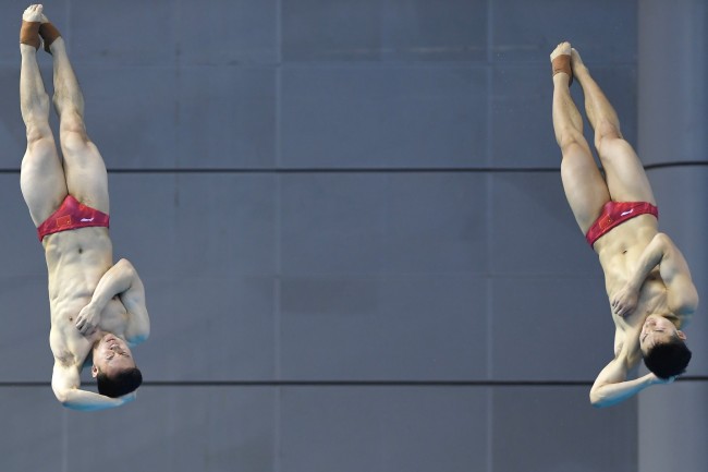 Xie Siyi (left) and Wang Zongyuan during the diving men's three-meter synchronized springboard final at the Military World Games in Wuhan on Saturday, October 27, 2019. [Photo provided to China Plus]