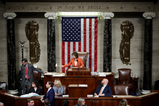 Speaker of the House Nancy Pelosi gavels the close of a vote by the US House of Representatives on a resolution formalizing the impeachment inquiry centered on US President Donald Trump October 31, 2019 in Washington, DC. [Photo: Win McNamee/POOL/AFP]