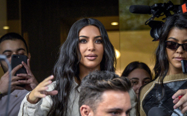 In this file photo taken on October 7, 2019 US reality television star Kim Kardashian (L) and her sister Kourtney Kardashian leave a hotel in Yerevan. [Photo: AFP]