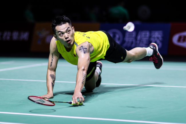 Lin Dan of China competes in the men's singles first round match against Chen Long of China on day two of the Fuzhou China Open at Haixia Olympic Sports Center on November 06, 2019 in Fuzhou, China. [Photo: VCG]