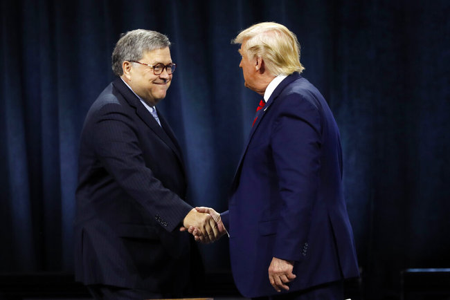 President Donald Trump shakes hands with Attorney General William Barr before Trump signed an executive order creating a commission to study law enforcement and justice at the International Association of Chiefs of Police Convention Monday, Oct. 28, 2019, in Chicago. [Photo: AP]