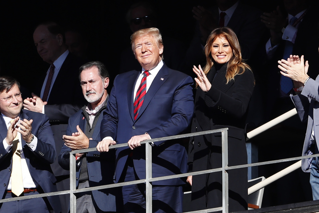 President Donald Trump watches the first half of an NCAA football game between Alabama and LSU with his wife Melania Saturday, Nov. 9, 2019, in Tuscaloosa, Alb. [Photo: AP]