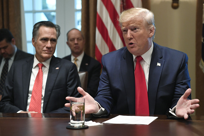 President Donald Trump, right, speaks as he sits next to Sen. Mitt Romney, R-Utah, left, as they participate in a meeting in the Cabinet Room of the White House in Washington, Friday, Nov. 22, 2019, on youth vaping and the electronic cigarette epidemic. [Photo: AP/Susan Walsh]