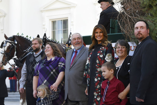 First lady Melania Trump poses with the 2019 White House Christmas tree as it is delivered to the White House in Washington, Monday, Nov. 25, 2019. [Photo: AP]