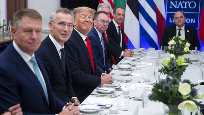 President Donald Trump smiles during a working lunch with NATO members that have met their financial commitments to the organization, at The Grove, Dec. 4, 2019, in Watford, the UK. [Photo: AP/Evan Vucci]