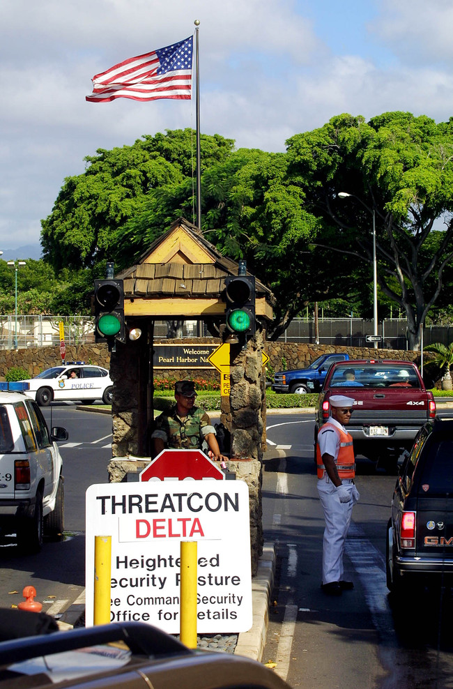 US Navy military police check vehicles at the Nimitz Gate entrance to Pearl Harbor Naval base in Hawaii 11 September, 2001. [File Photo: AFP/MIKE NELSON]