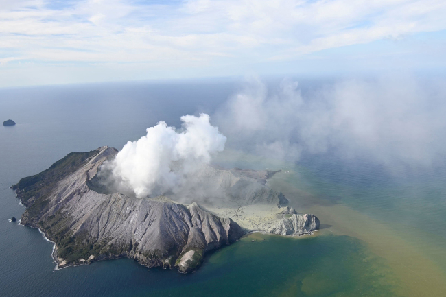 This aerial photo shows White Island after its volcanic eruption in New Zealand Monday, Dec. 9, 2019. [Photo: George Novak/New Zealand Herald via AP]