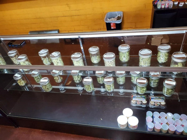 This Thursday, Dec,. 12, 2019 photo provided by the Department of Consumer Affairs shows a display with jars of marijuana at Save Greens Cannabis dispensary in Los Angeles. [Photo: AP]