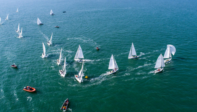 Sailing teams compete during the Belt and Road Regatta Beihai station on Dec 13, 2019. [Photo provided to ChinaPlus]