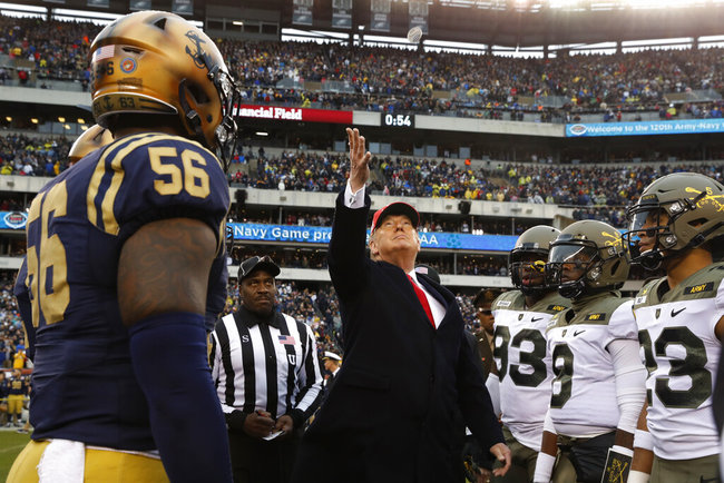 President Donald Trump throws the coin before the start of the Army-Navy college football game in Philadelphia, Saturday, Dec. 14, 2019. [Photo: AP]