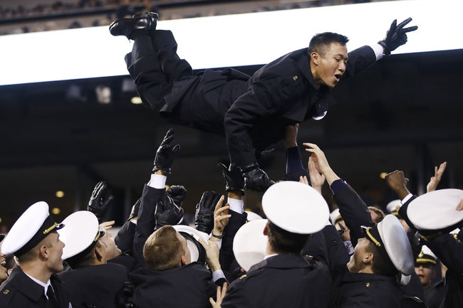 Navy midshipmen celebrate a Navy touchdown during the second half of an NCAA college football game, Saturday, Dec. 14, 2019, in Philadelphia. Navy won 31-7. [Photo: AP/Matt Rourke] 