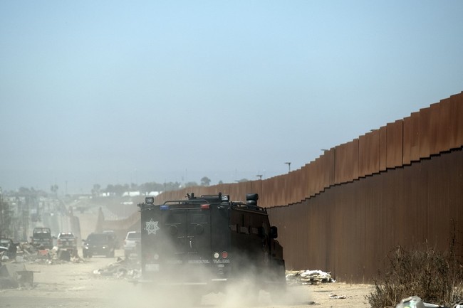 Mexican security forces patrol the US-Mexico border fence in Tijuana Baja California state, Mexico, on September 18, 2019. [File photo: AFP/Guillermo Arias]