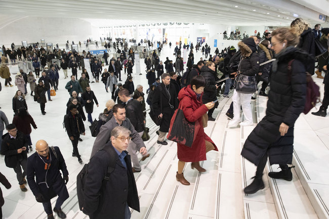 Commuters pass through the World Trade Center in New York City on Wednesday, December 4, 2019. [Photo: AP]