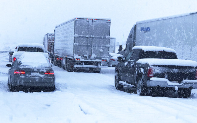 This photo provided by Johnny Lim shows a snow covered northbound I-15 in the Cajon Pass between the San Bernardino Mountains and the San Gabriel Mountains in Southern California on Thursday, Dec. 26, 2019. [Photo: AP]