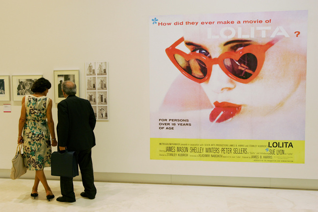 In this file photo taken on October 04, 2007 visitors look over a poster of "Lolita" by Stanley Kubrick during an exhibition organised for the reopening of the "Palazzo delle Esposizioni" in Rome. [Photo: Vincenzo PINTO/AFP]