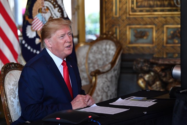 In this file photo taken on December 24, 2019 US President Donald Trump makes a video call to the troops stationed worldwide at the Mar-a-Lago estate in Palm Beach Florida. [Photo: AFP]