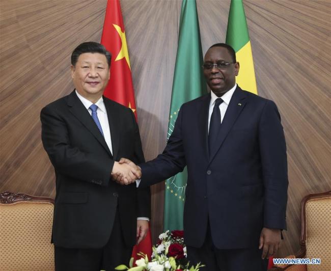 Le président Xi Jinping effectue sa première visite en Afrique de l’Ouest et s’entretient avec son homologue sénégalais Macky Sall