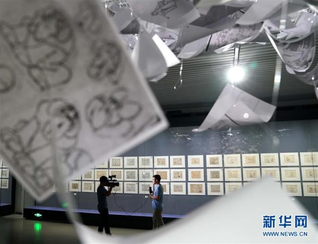 Photo prise le 23 juillet à l’exposition de dessins animés tenue à la Bibliothèque nationale de Chine à Beijing. Des centaines de dessins animés originaux y sont exposés pour la première fois en Chine. Des dessins originaux deBlanche-Neige et les Sept Nains, deDragon Ballet deDetective Conanfont partie de l’exposition.