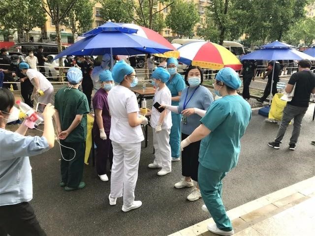 Residentes de Beijing estão em ação para combater COVID-19